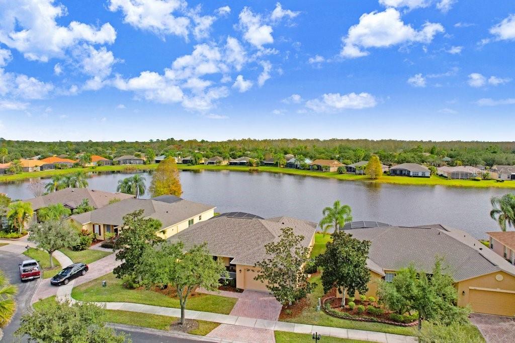 699 Glendora Road Kissimmee, FL 34759 - Photo 47 of 56 a view of a lake with a flower garden