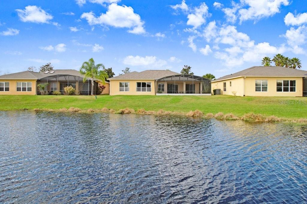 699 Glendora Road Kissimmee, FL 34759 - Photo 8 of 56 a front view of a house with a garden