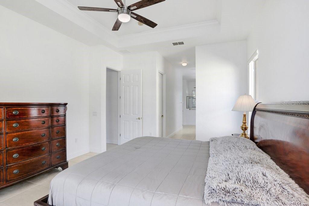 699 Glendora Road Kissimmee, FL 34759 - Photo 10 of 56 a bedroom with a bed and a dresser