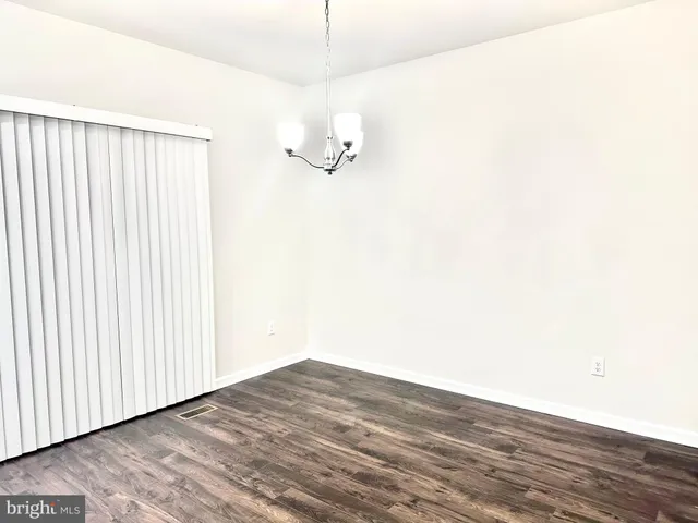 a front view of building with yard