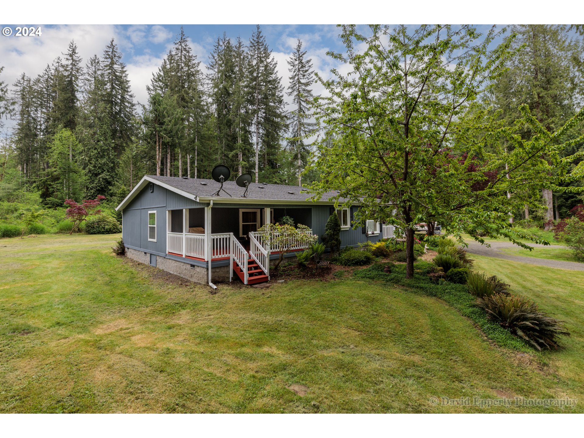 24534 Warren Road Rainier, OR 97048 - Photo 25 of 34 a view of a house with garden and trees