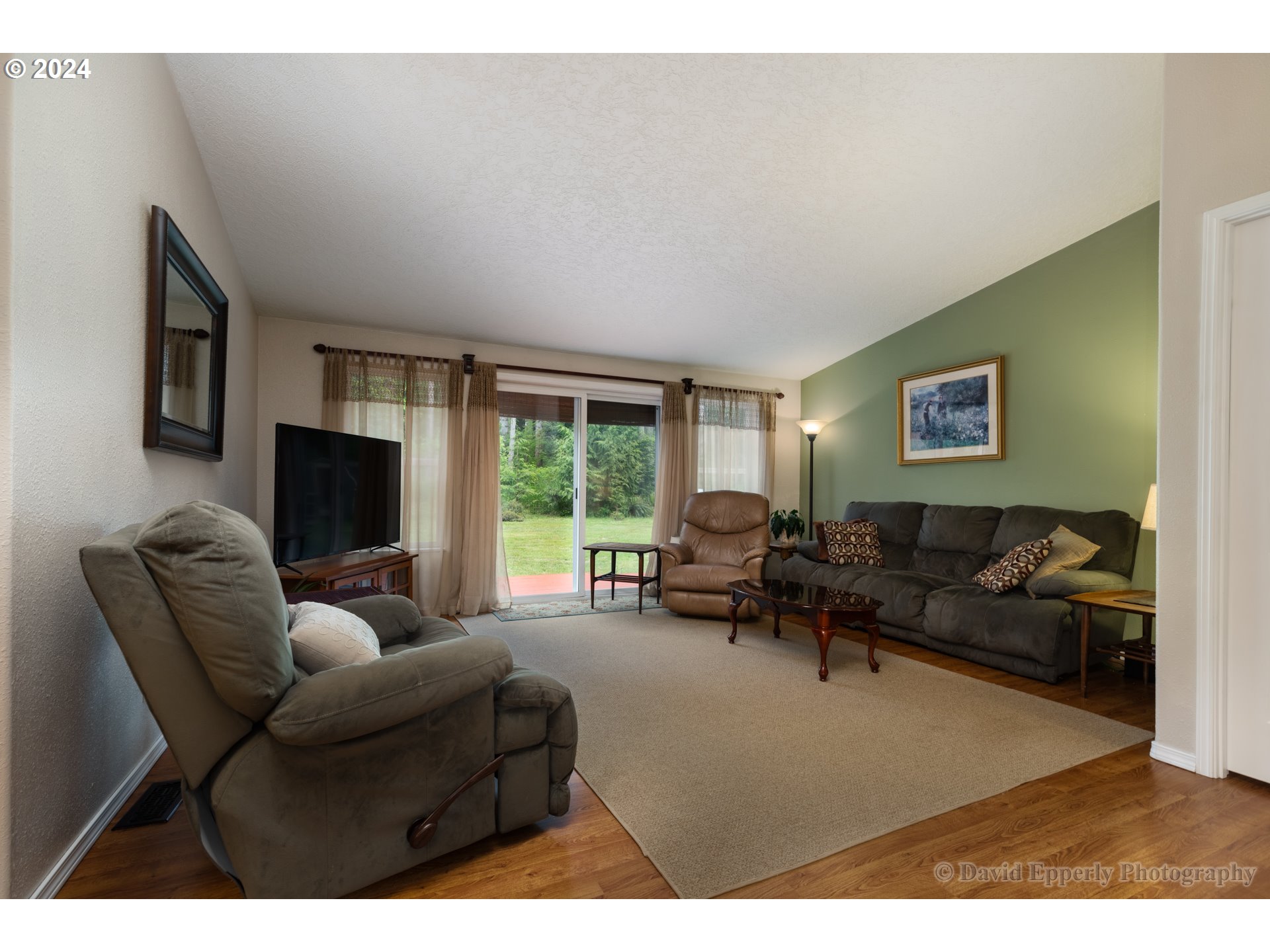 24534 Warren Road Rainier, OR 97048 - Photo 6 of 34 a living room with furniture and a flat screen tv