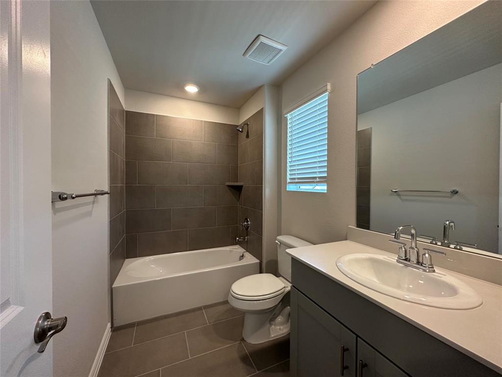 123 Monarch Way Wylie, TX 75098 - Photo 20 of 36 a bathroom with a sink a toilet and shower