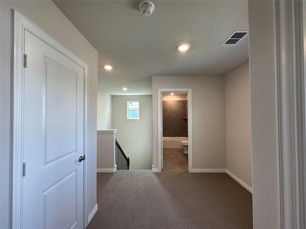 123 Monarch Way Wylie, TX 75098 - Photo 24 of 36 a view of hallway with livingroom and wooden floor