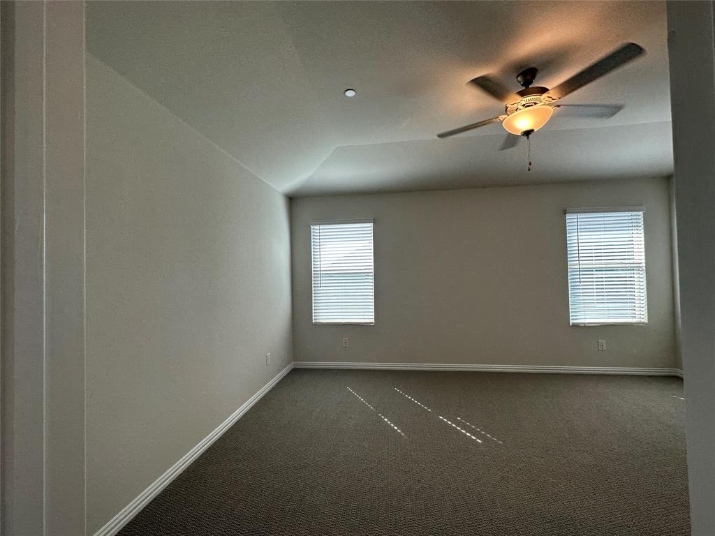 123 Monarch Way Wylie, TX 75098 - Photo 36 of 36 an empty room with a ceiling fan and window