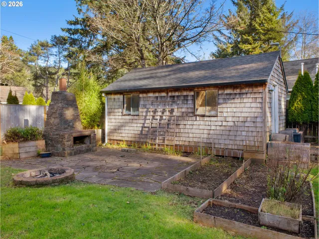 a view of backyard with a garden and plants