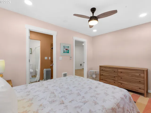 a bedroom with a bed and a dresser