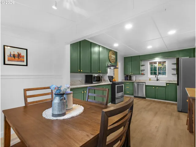 a kitchen with a table and chairs