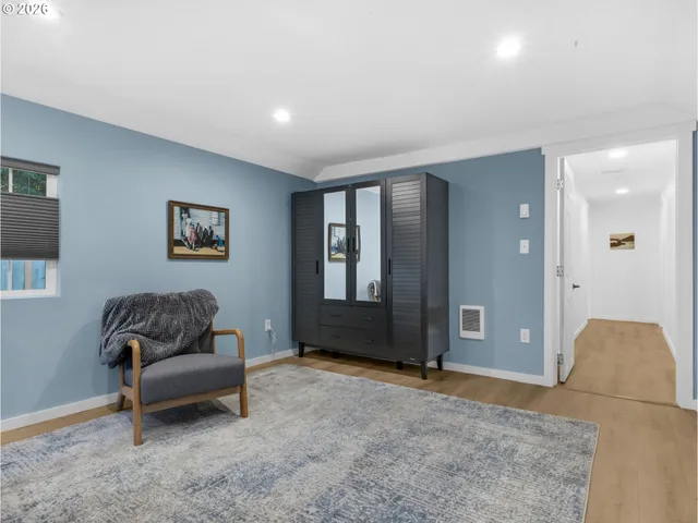 a living room with a couch and a large window