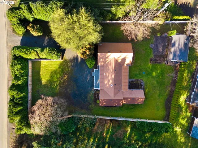 an aerial view of a house with a garden