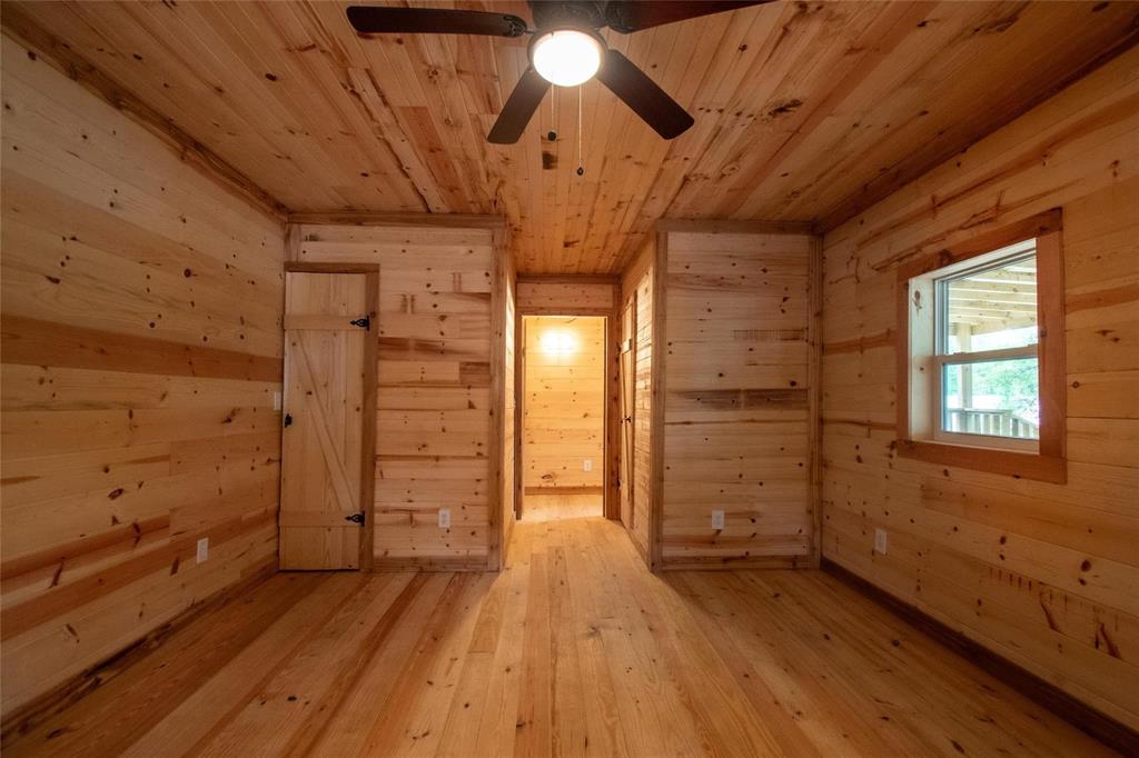 111 Ridgewood Lane Murchison, TX 75778 - Photo 27 of 38 a view of empty room with wooden floor and window