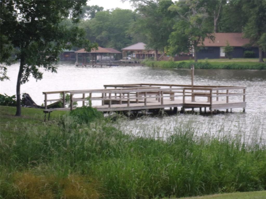 111 Ridgewood Lane Murchison, TX 75778 - Photo 34 of 38 a view of a lake with a yard