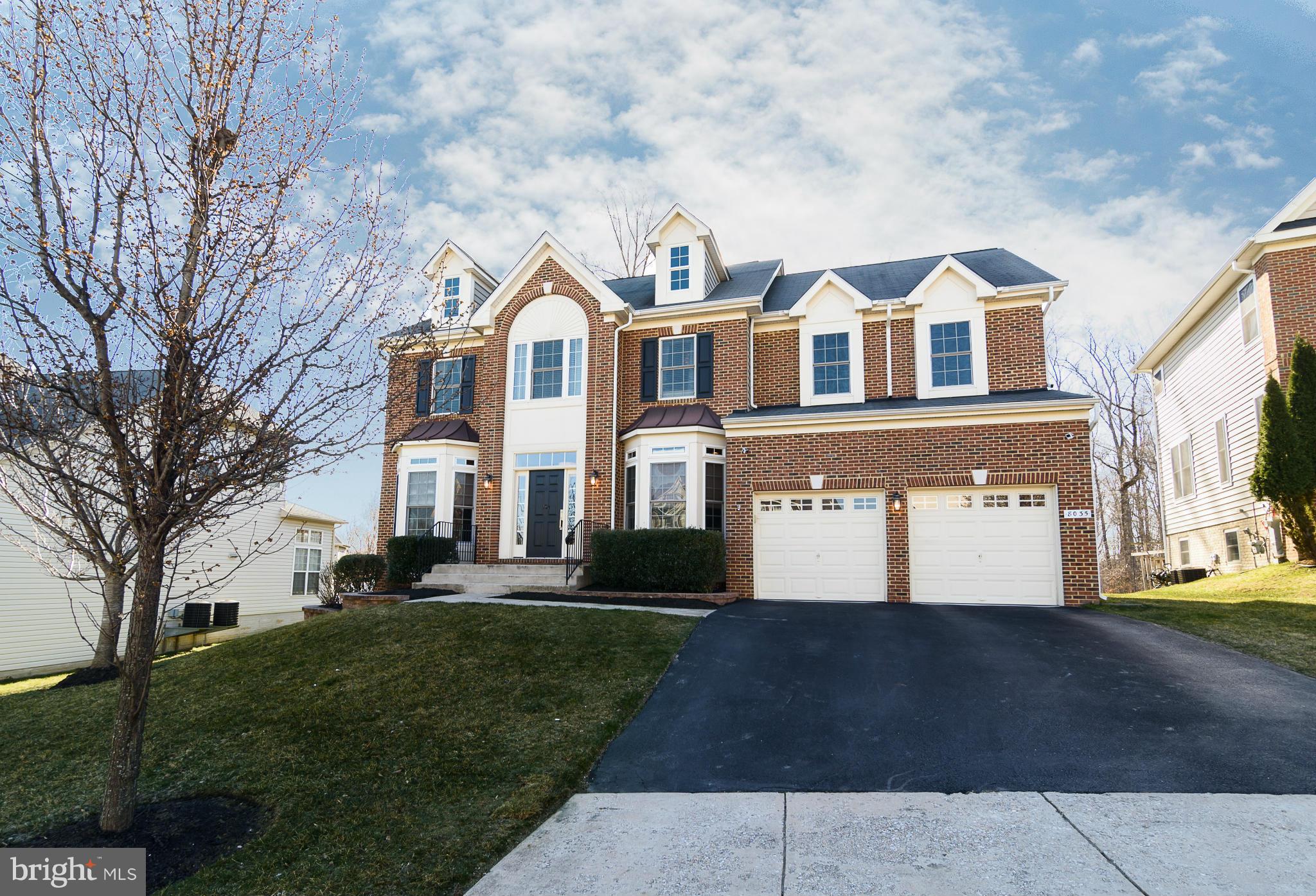 Brick front 2-car garage colonial