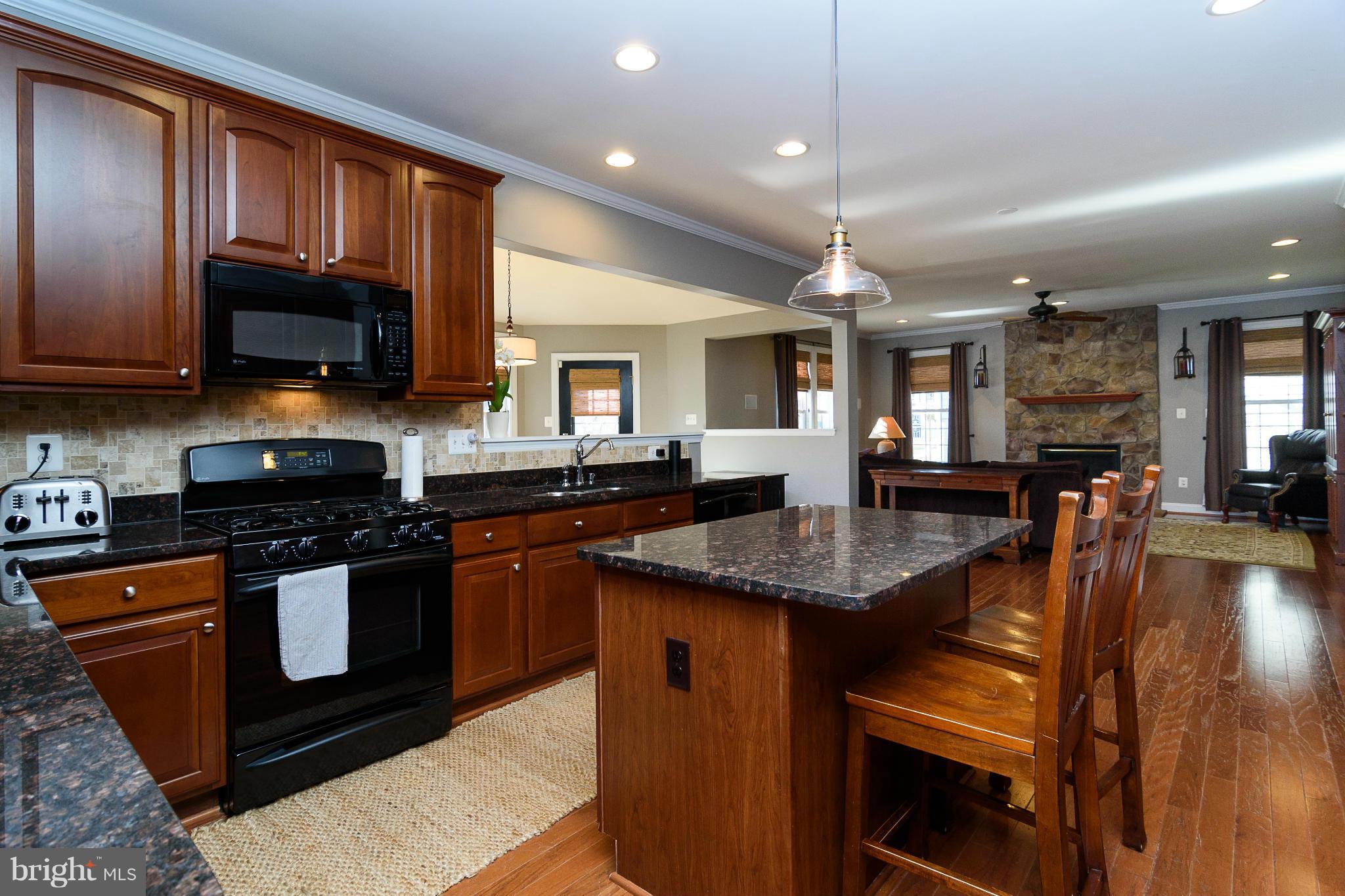 Granite counters and stone tile backsplash