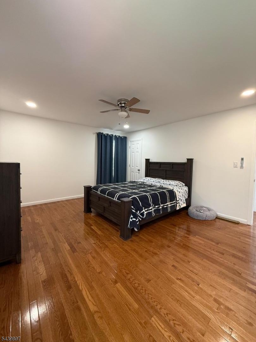 22 Karen Road Vernon, NJ 07422 - Photo 19 of 26 a room with a bed and wooden floor