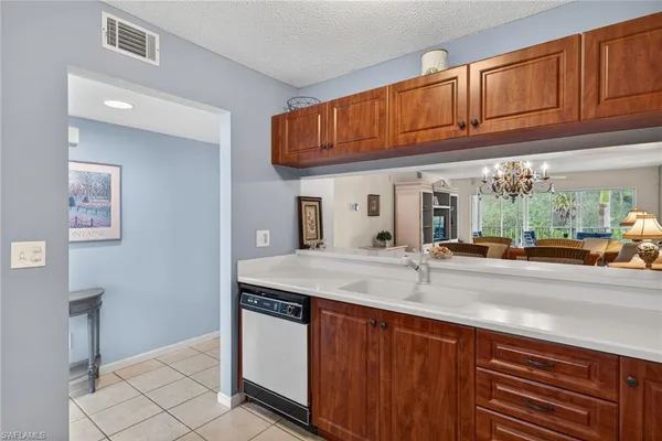 a kitchen with stainless steel appliances granite countertop a sink and cabinets
