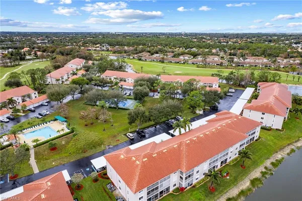 an aerial view of a house with a lake view