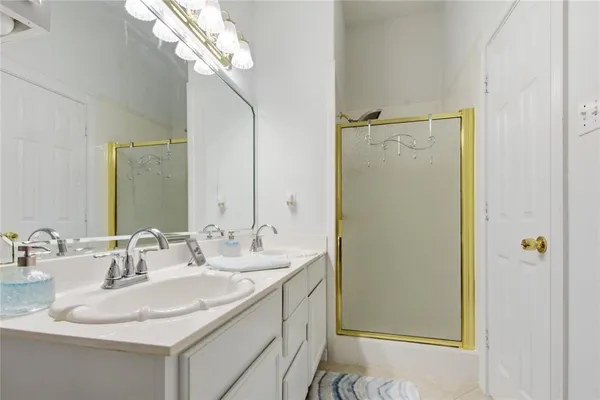 a view of a backyard with table and chairs under an umbrella