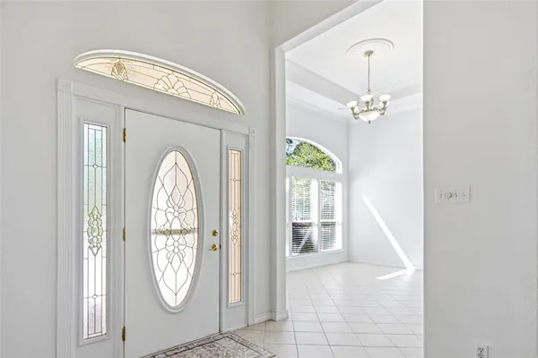 a kitchen with stainless steel appliances granite countertop a sink and a refrigerator