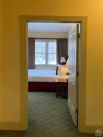 a bathroom with a tub sink and window