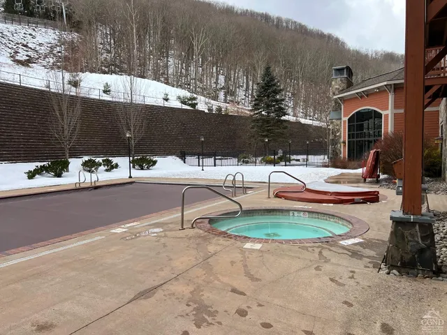 a view of patio with swimming pool