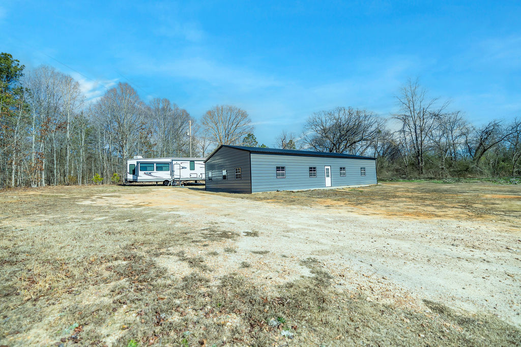 900 Asaville School Road Anderson, SC 29621 - Photo 2 of 29 This spacious property offers an ideal blend of open land and a versatile outbuilding.