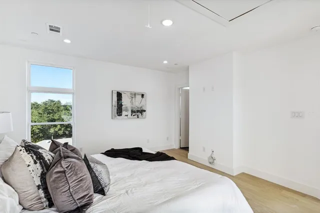 a bathroom with a granite countertop sink toilet and mirror
