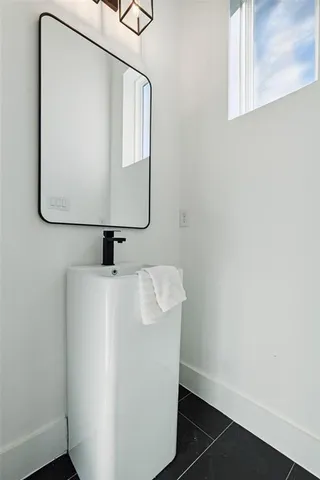 a close view of a utility room with a window and a ceiling fan
