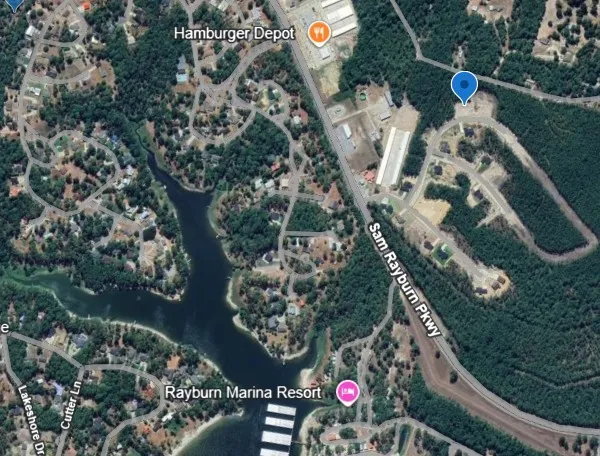 an aerial view of a highlighted house