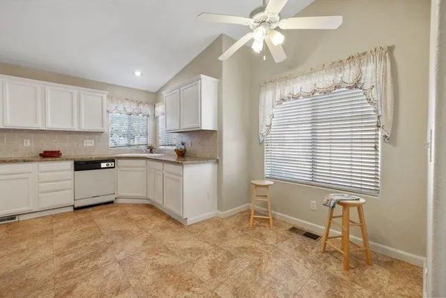 a bathroom with a sink and cabinets
