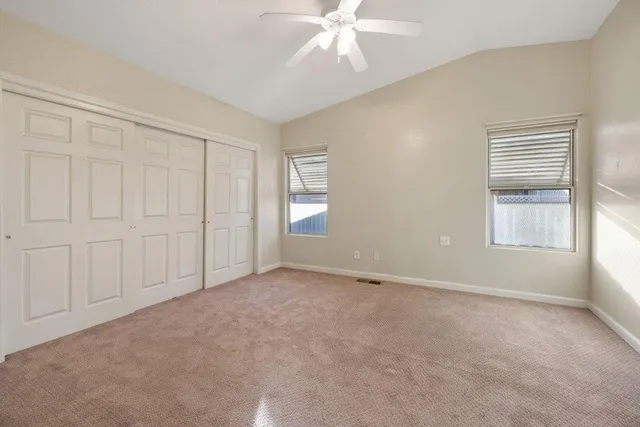 a view of an empty room with a window