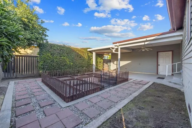 a view of a house with a yard and garage