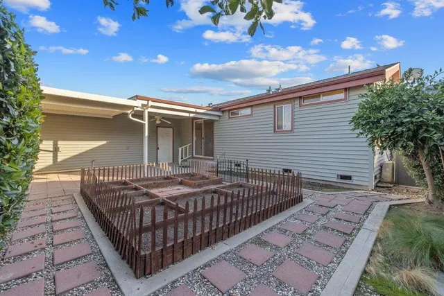 a front view of a house with garden