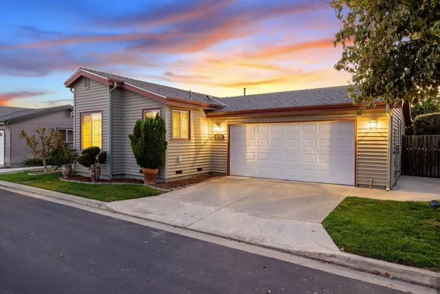 a front view of house with deck