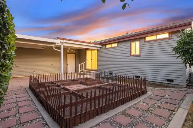 a view of a backyard with sitting area
