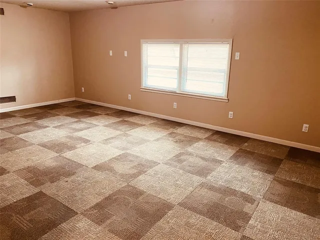 an empty room with windows