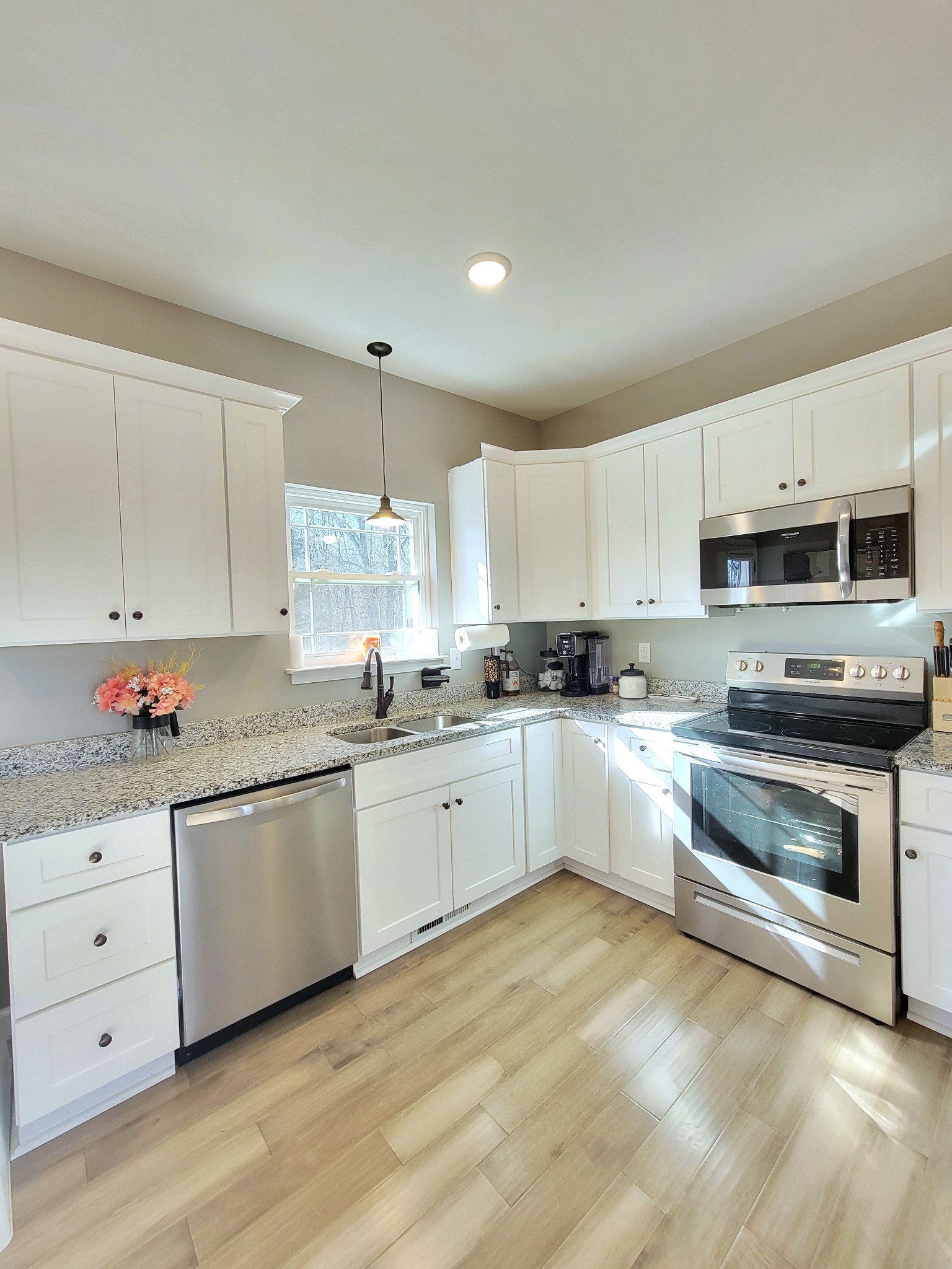 1152 Oak Grove Road Dickson, TN 37055 - Photo 14 of 53 a kitchen with granite countertop white cabinets and white appliances