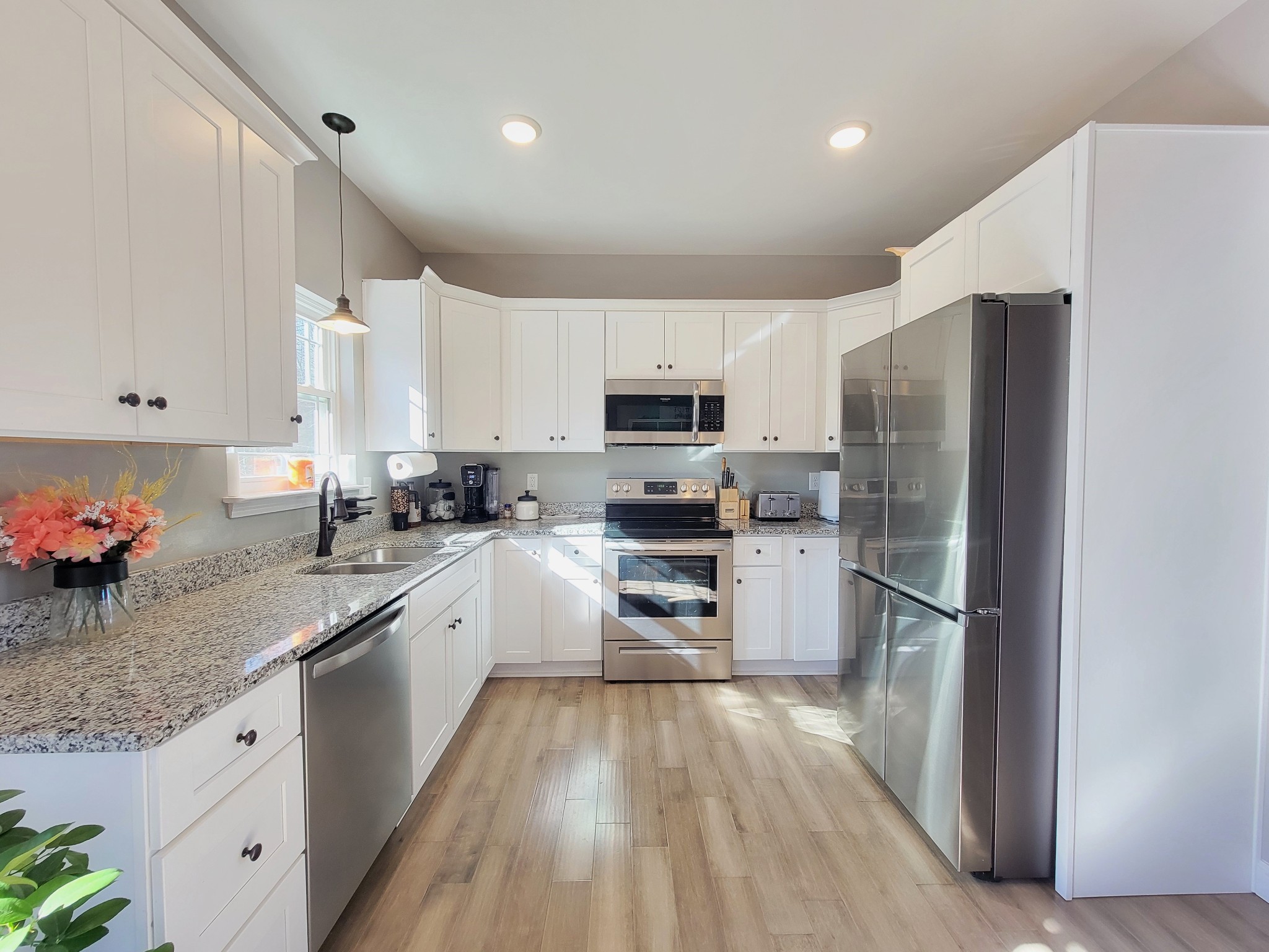 1152 Oak Grove Road Dickson, TN 37055 - Photo 16 of 53 a kitchen with granite countertop stainless steel appliances and refrigerator
