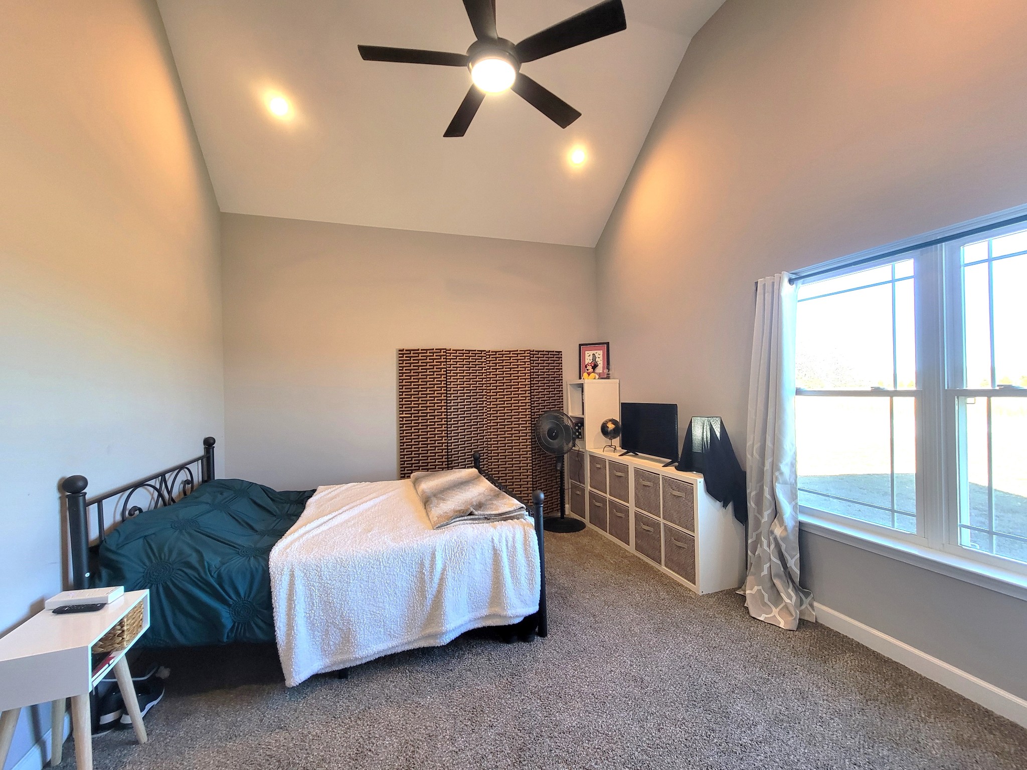 1152 Oak Grove Road Dickson, TN 37055 - Photo 21 of 53 a bedroom with a bed and a chandelier
