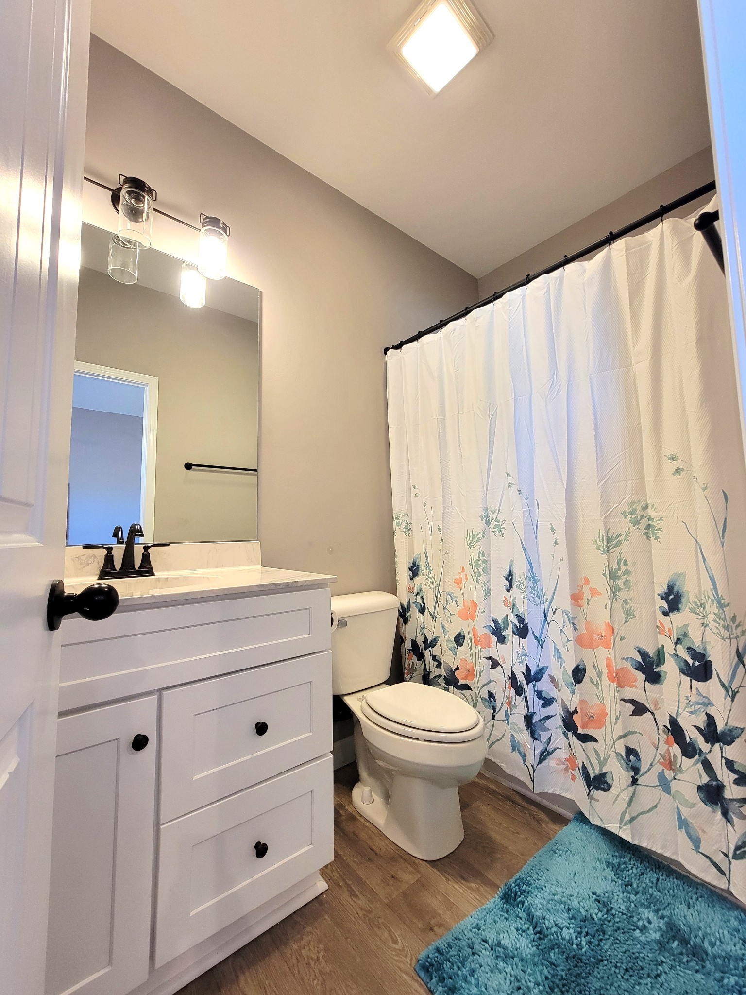 1152 Oak Grove Road Dickson, TN 37055 - Photo 25 of 53 a bathroom with a toilet sink and mirror