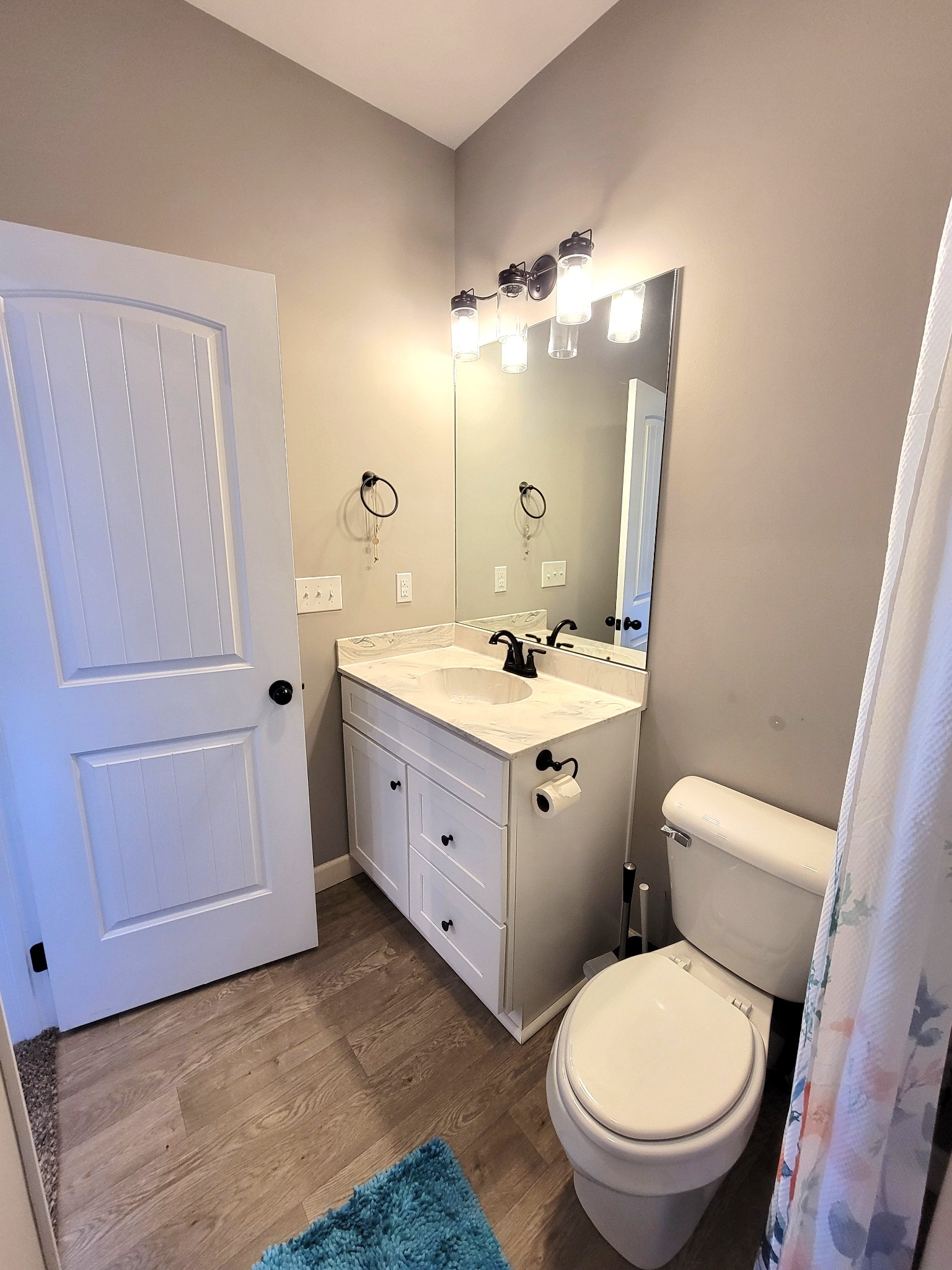 1152 Oak Grove Road Dickson, TN 37055 - Photo 26 of 53 a bathroom with a toilet a sink and mirror