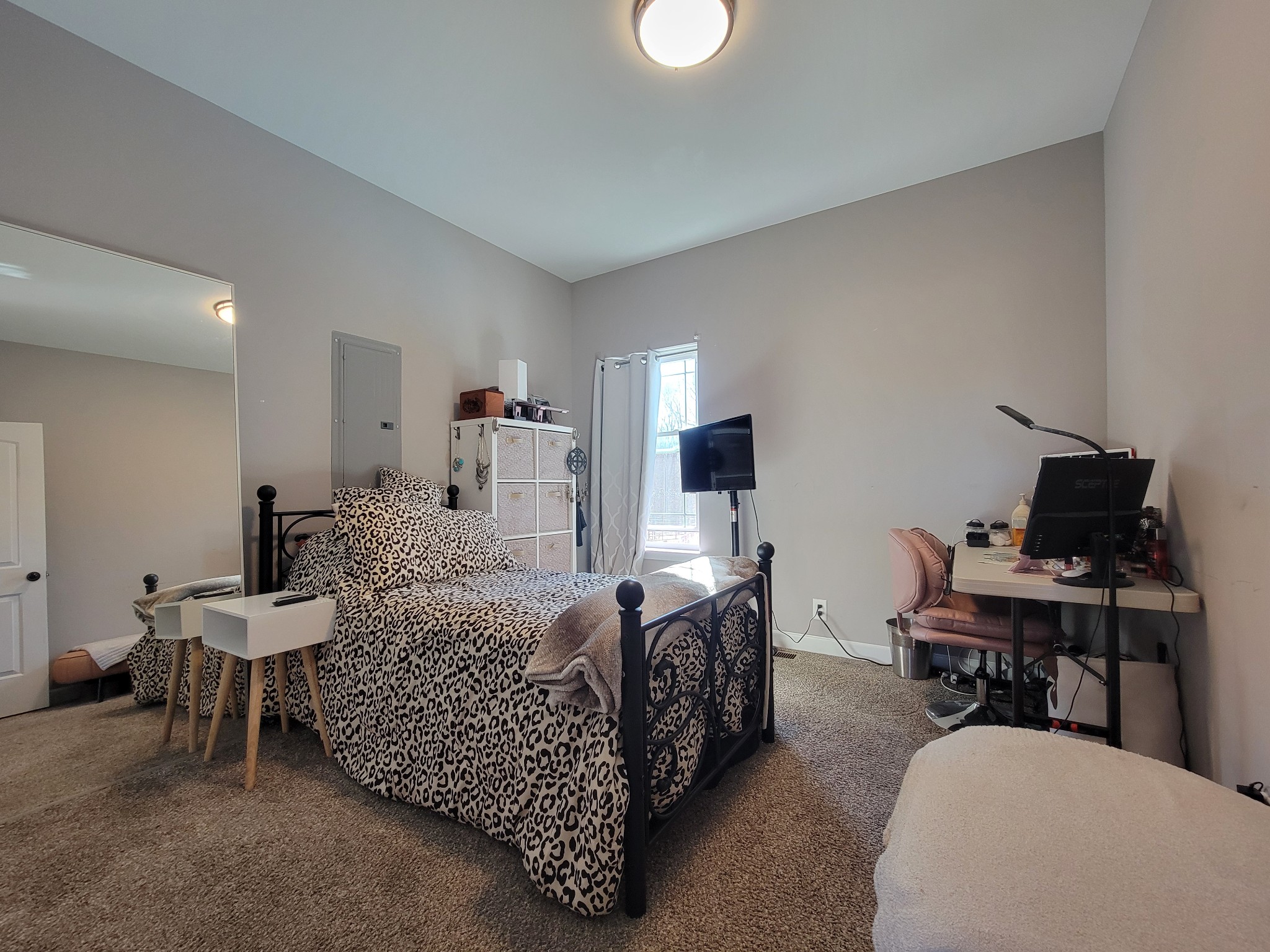 1152 Oak Grove Road Dickson, TN 37055 - Photo 27 of 53 a bedroom with furniture and a flat screen tv