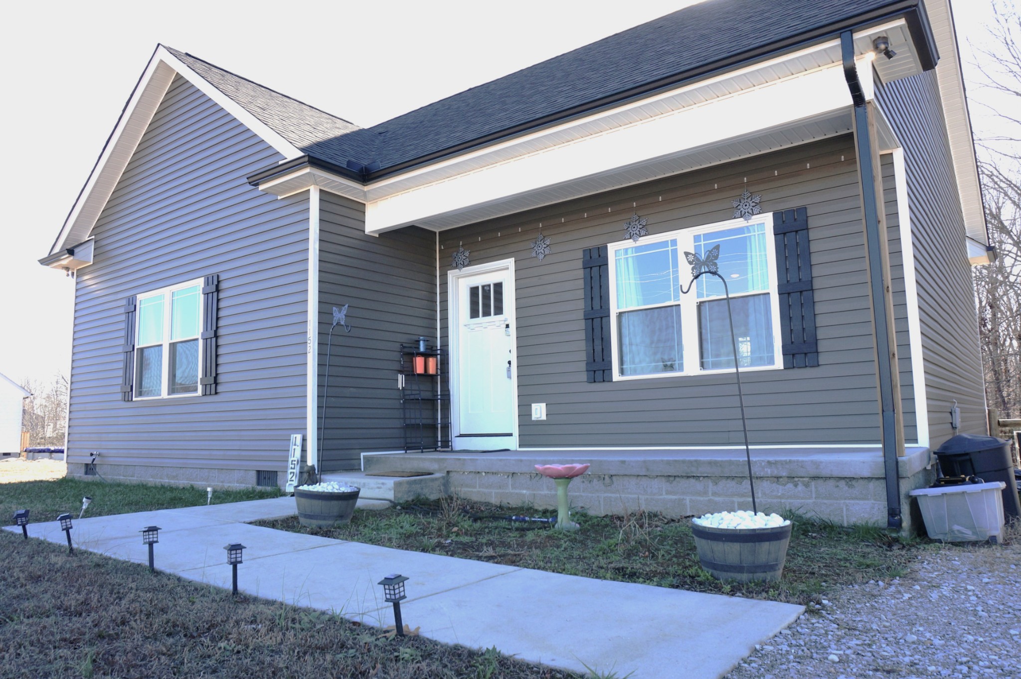 1152 Oak Grove Road Dickson, TN 37055 - Photo 4 of 53 a front view of a house with garden