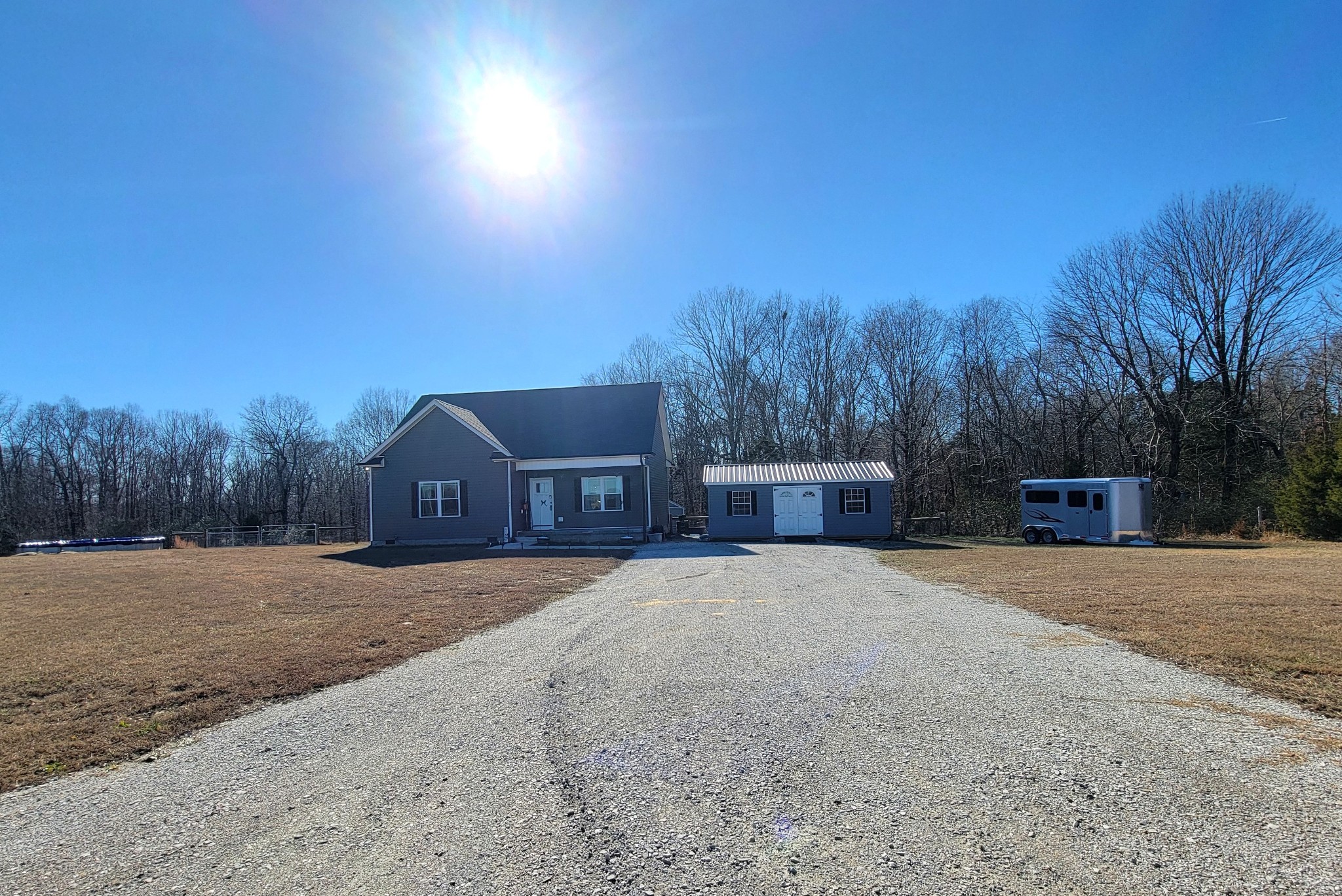 1152 Oak Grove Road Dickson, TN 37055 - Photo 50 of 53 a front view of a house with a yard and trees