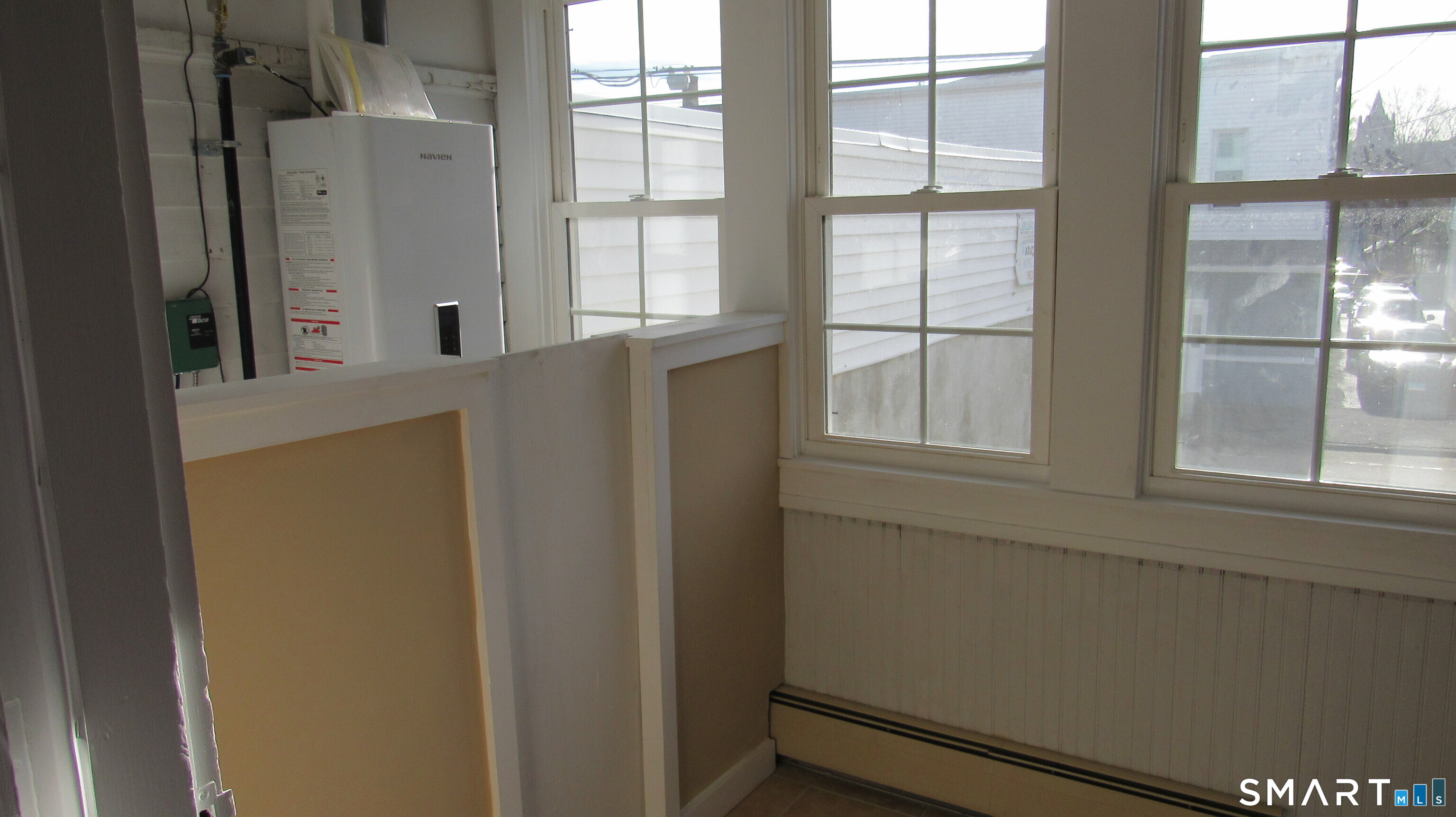 246 North Elm Street Torrington, CT 06790 - Photo 8 of 11 a view of an empty room with a window