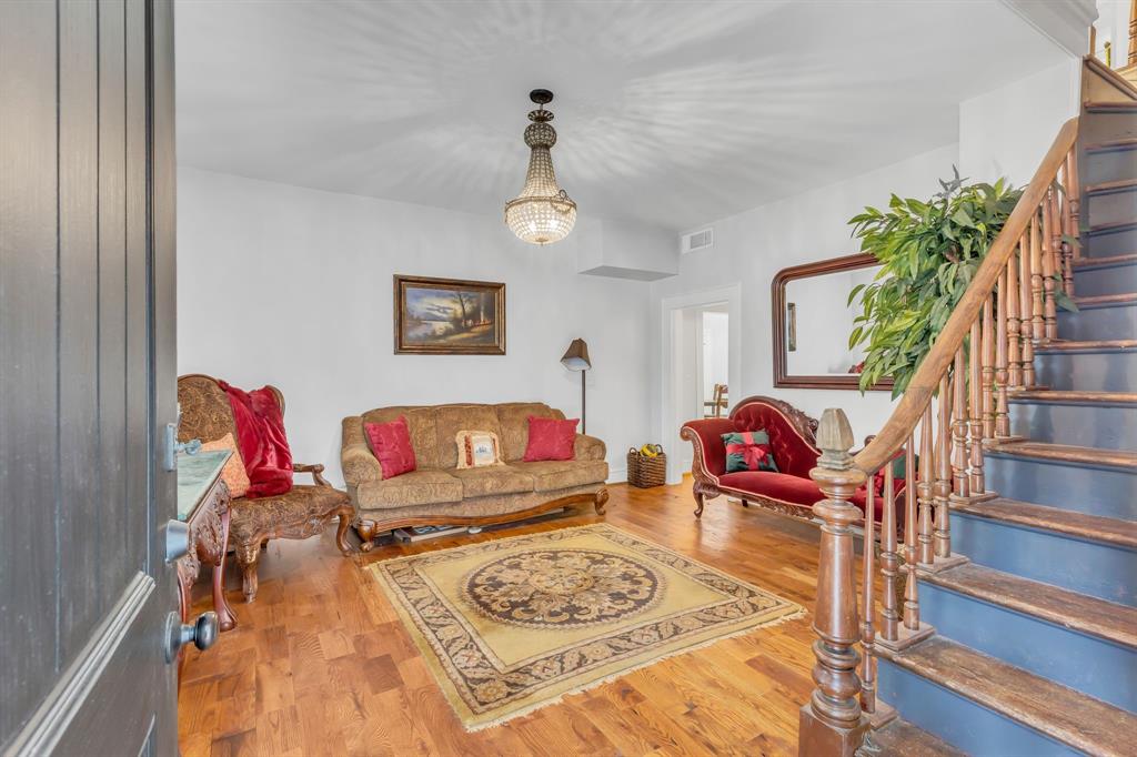 701 Johnson Street Terrell, TX 75160 - Photo 11 of 33 Front living room or parlor featuring original chandelier