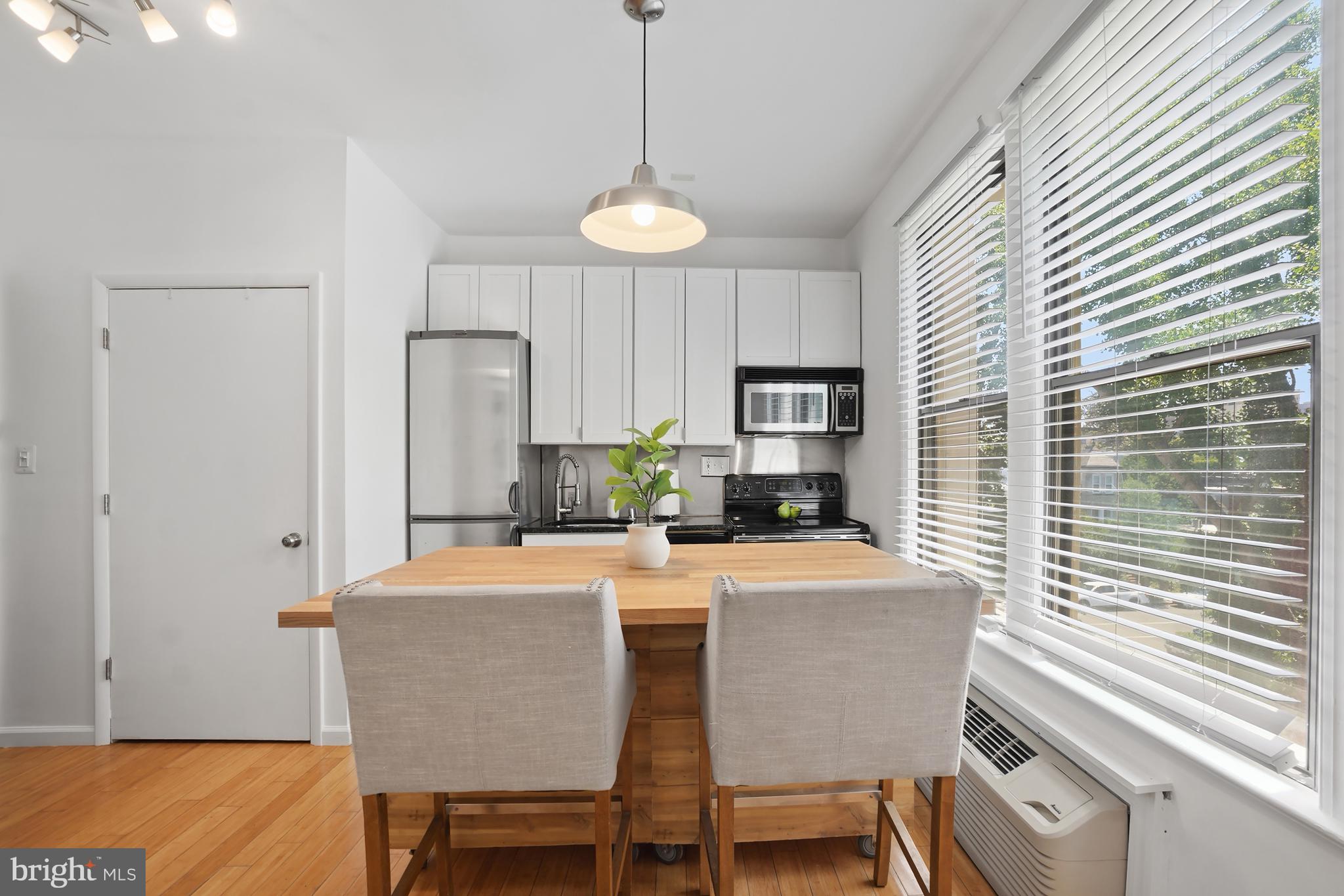 1822 15th Street Northwest, Unit 303 Washington, DC 20009 - Photo 3 of 22 a dining room with furniture and window