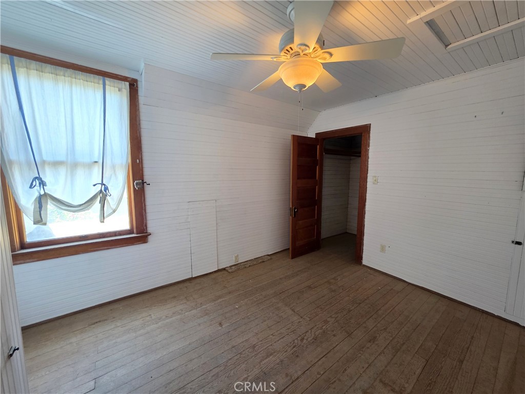 1414 Marin Street Corning, CA 96021 - Photo 20 of 43 an empty room with a window and chandelier