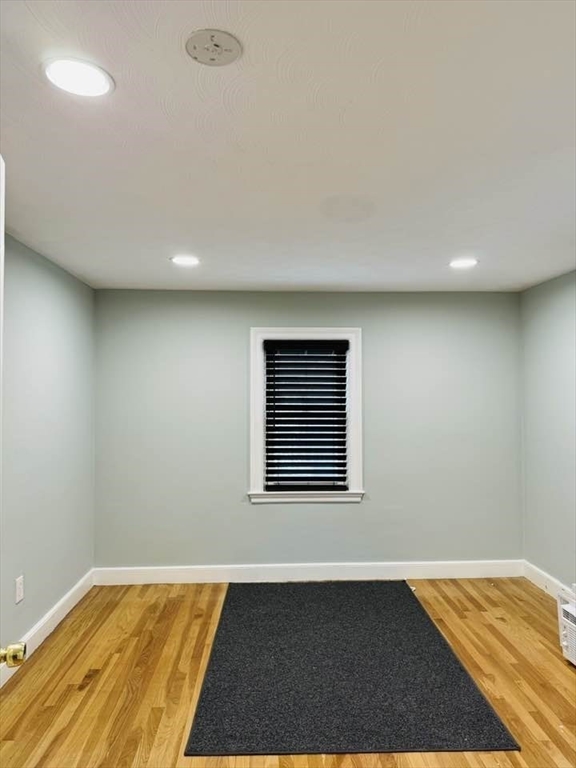369 Union Street Ashland, MA 01721 - Photo 12 of 22 a view of empty room with wooden floor and fan