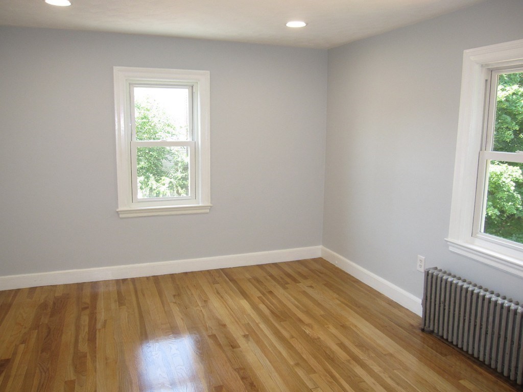 369 Union Street Ashland, MA 01721 - Photo 13 of 22 an empty room with wooden floor and a window